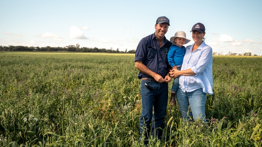Dave and Alice Woods and their son James stand in the middle of a green, multi-species cover crop near Goondiwindi, August 2021.