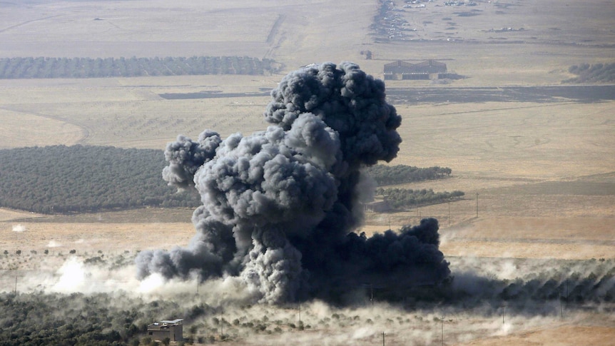 Smoke rises at Islamic State militants' positions in Naweran