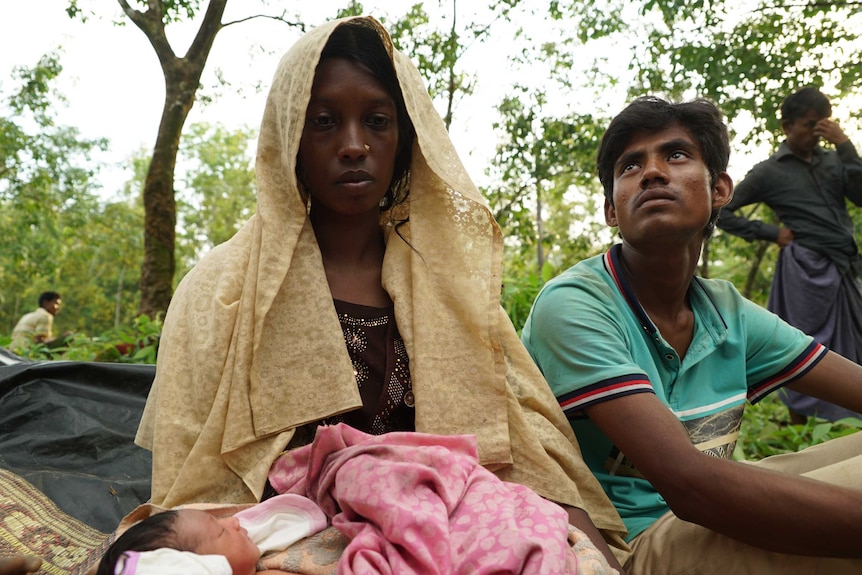 Rohingya Muslim refugees Ali Johar and his wife Khuthija in Bangladesh with their two-day-old baby girl.