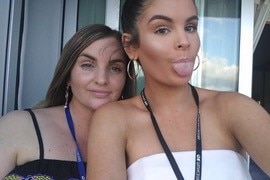 Two women pose for a selfie.