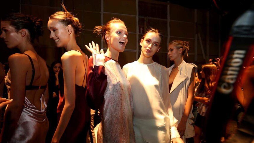 Models have some fun backstage at Australian Fashion Week in Sydney