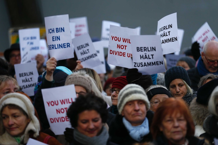 Berliners and refugees sing We are the World