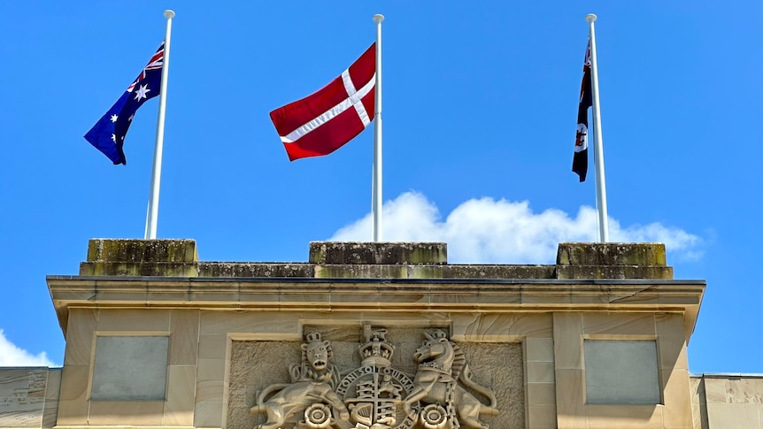 The Danish flag flying between the Australian and Tasmanian flags at parliament house in Hobart