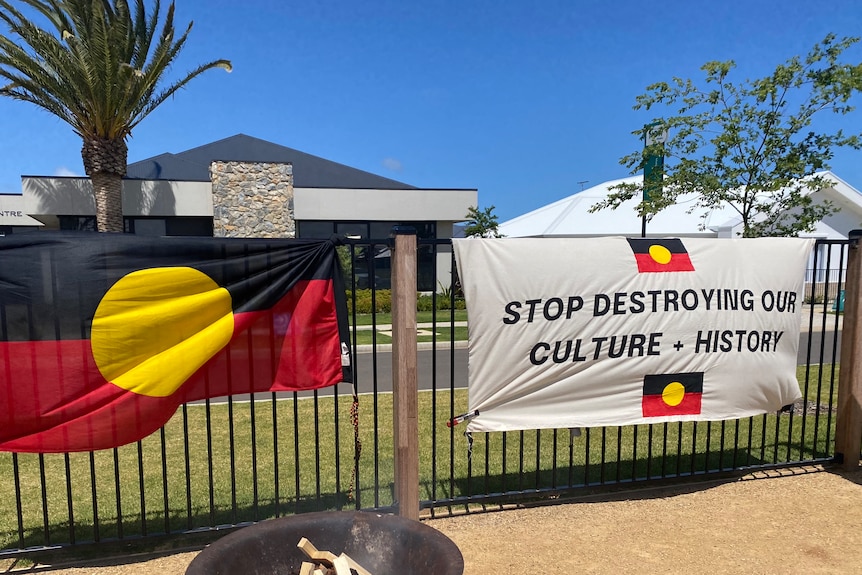 The Australian Aboriginal flag tied to a fence as part of a protest.