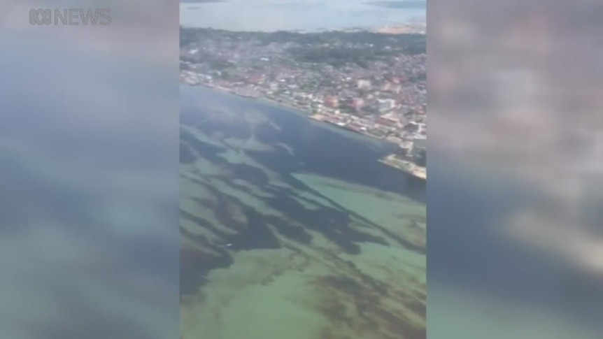 Aerial footage shows the oil spill has spread across a wide area.