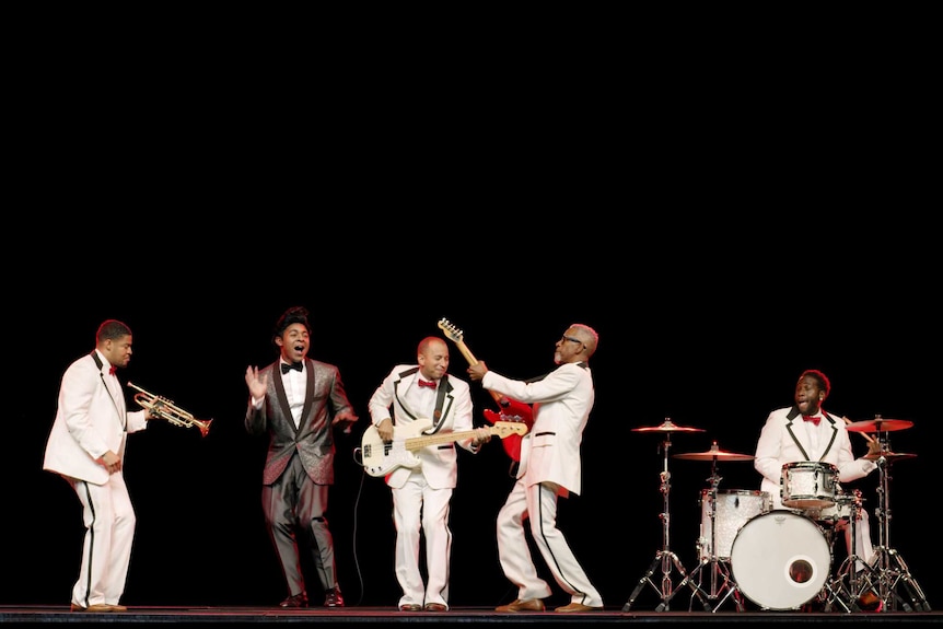 Jackie Wilson sings with his band, who play instruments