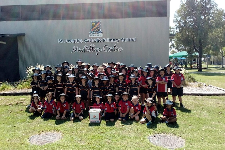 A group of primary school students in Blackall with the esky.