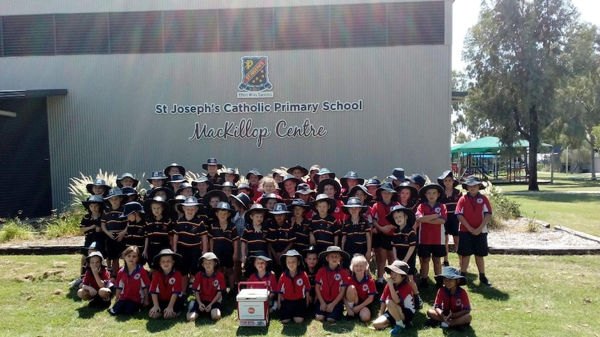 A group of primary school students in Blackall with the esky.