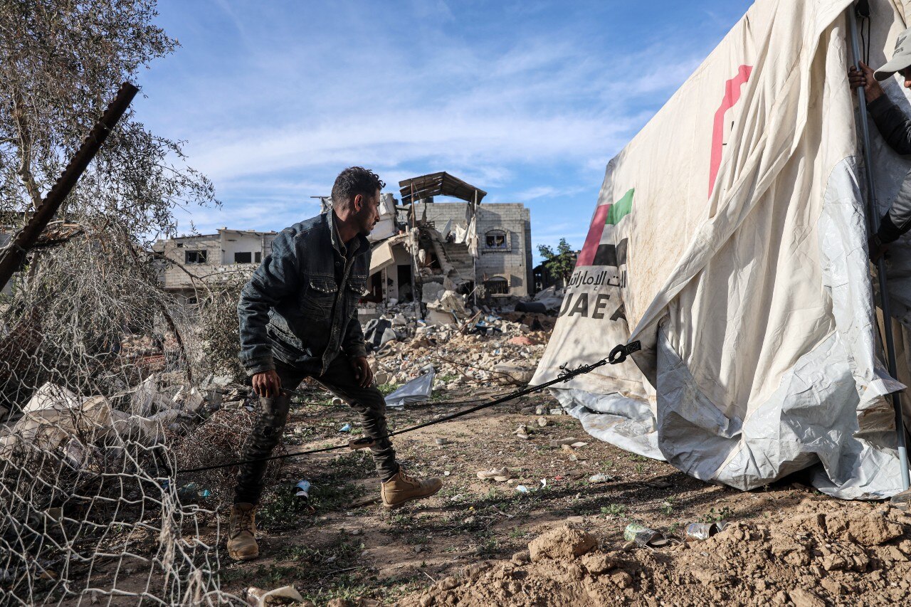 A man clearing a pile of debris