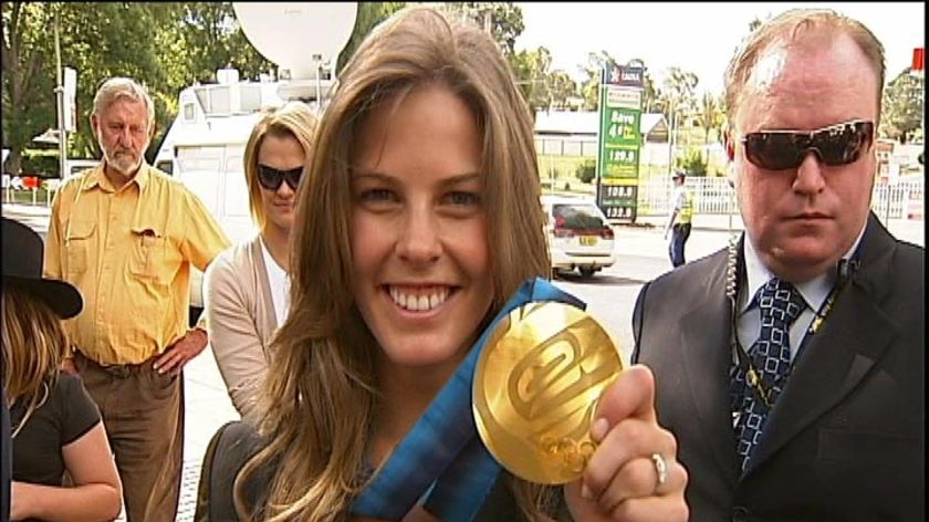Bright shows off her gold medal in Cooma