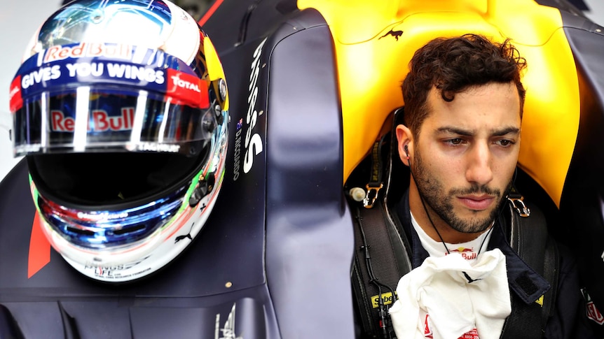 Daniel Ricciardo looks on in the Red Bull cockpit