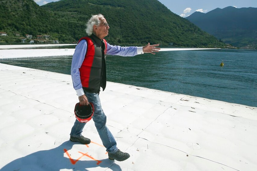 Christo Vladimirov Yavachev, known as Christo, walks on his installation 'The Floating Piers'.