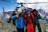 Rescuers assist a foreigner who was injured following an avalanche at the Mount Manaslu base camp.
