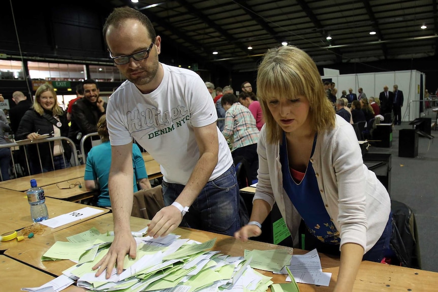 People sort votes at a count centre in Dublin following the vote on same-sex marriage in Ireland