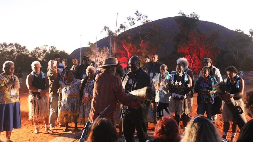Aboriginal and Torres Strait Islanders exchange gifts at the opening ceremony of the Uluru summit.
