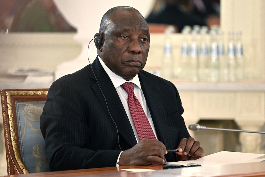 South African President Cyril Ramaphosa attends a meeting of Russian President Vladimir Putin.