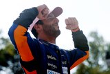 Daniel Ricciardo poses after winning the 2021 Italian Grand Prix
