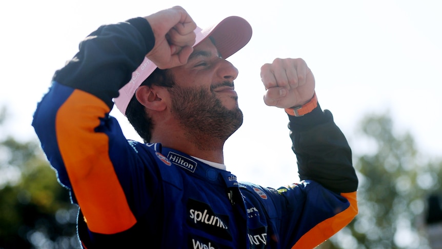 Daniel Ricciardo poses after winning the 2021 Italian Grand Prix