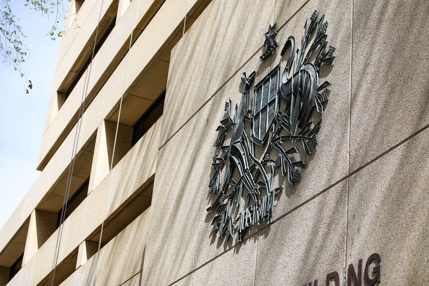 A close up of the insignia on the exterior of the Federal Court of Australia building in Perth.