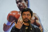 Manny Pacquiao sits during a press conference in this 2019 file photo.