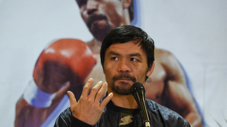 Manny Pacquiao sits during a press conference in this 2019 file photo.