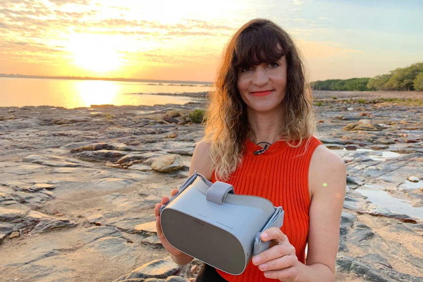 Darwin film maker Caro Macdonald stands on a beach in Darwin.