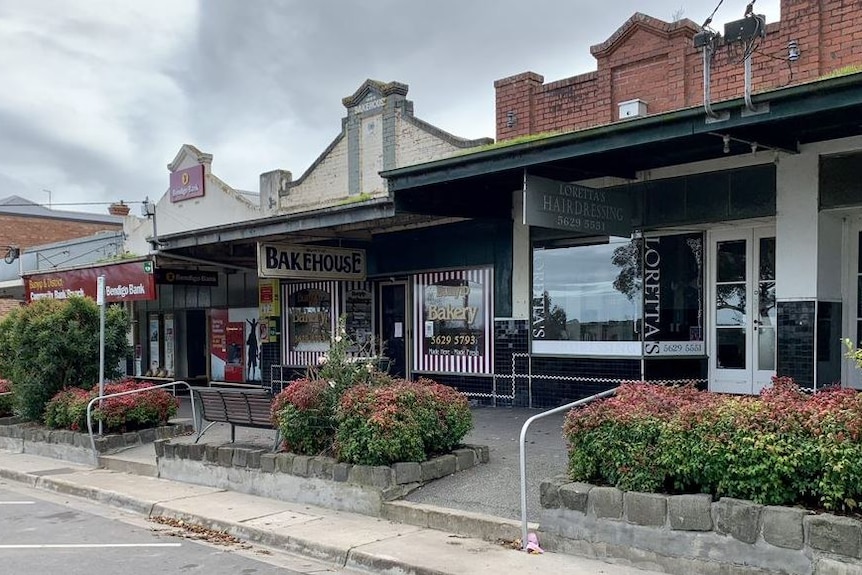 Closed shops on a country town's main street.