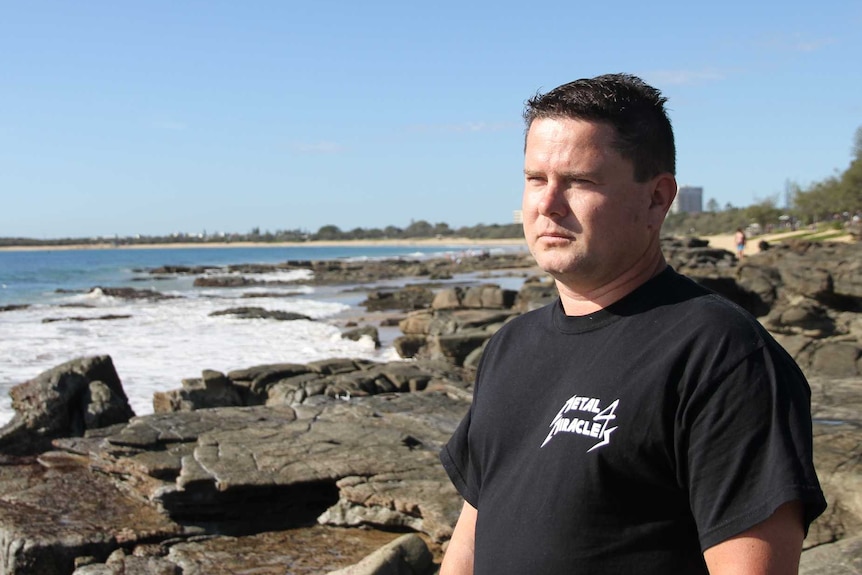 Matthew Horder looks out to the ocean at Mooloolaba Beach where his parents ashes were scattered.