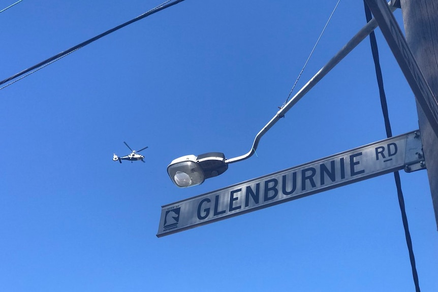 A police helicopter is seen near a hit-and-run on Glenburnie Road in Mitcham.
