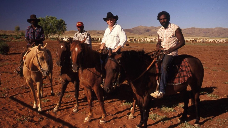 Lee Kernaghan and three station workers on horseback at Amburla Station, NT
