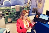 Viktoria Marinova reading off an iPad.