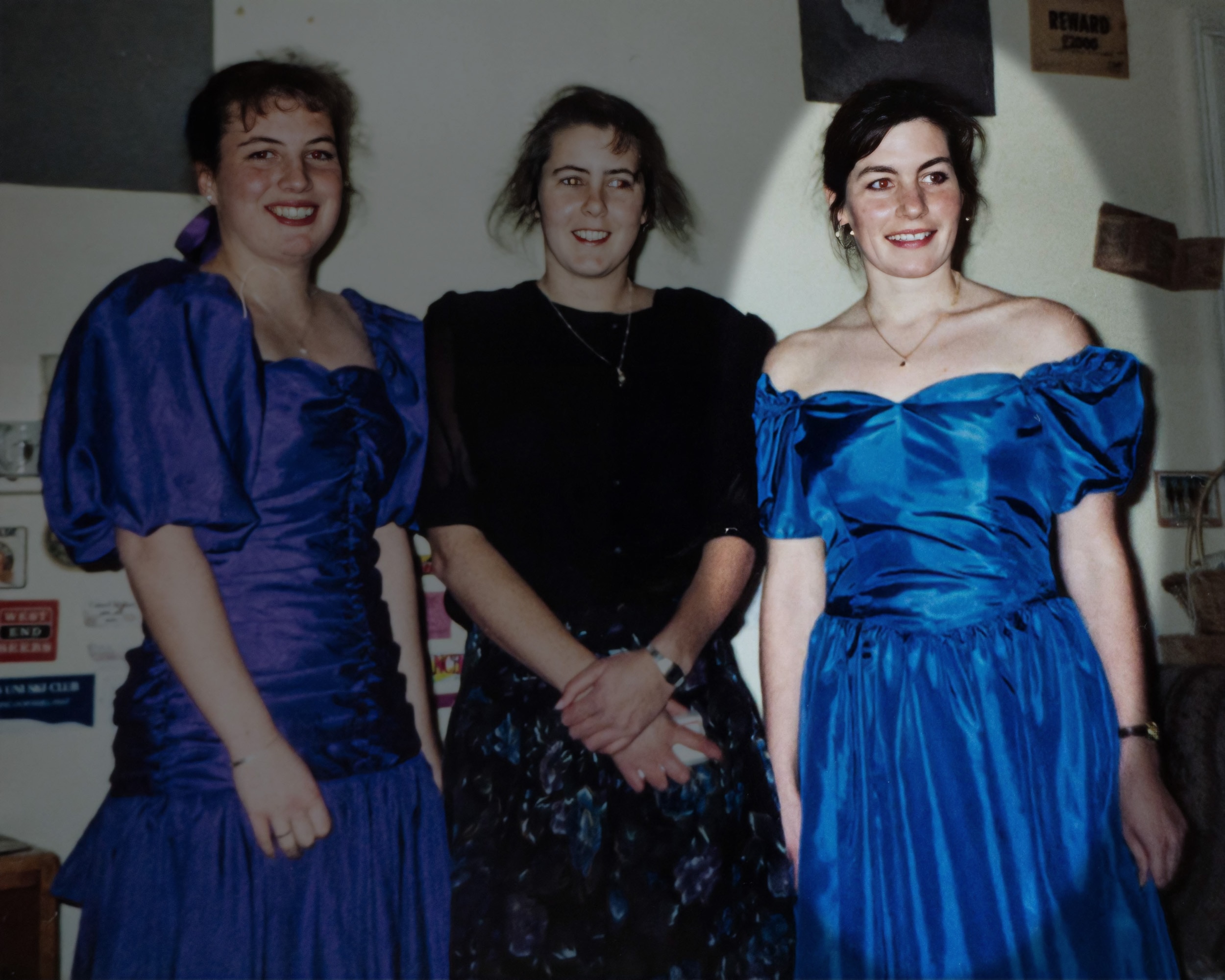 Three young women dressed up.