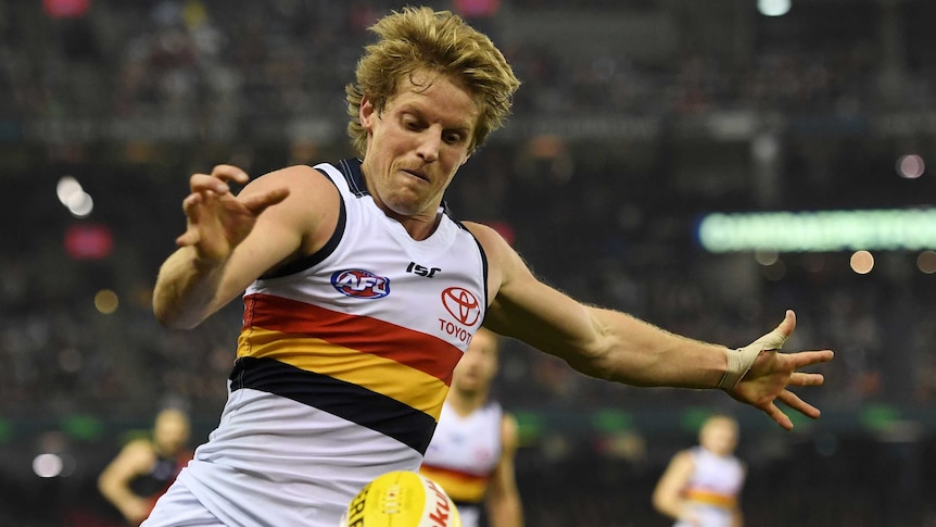 The Crows Rory Sloane has a kick against the Bombers