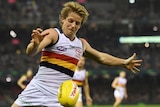 The Crows Rory Sloane has a kick against the Bombers