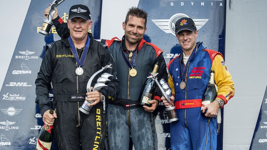 Newcastle's Matt Hall (right) celebrates his third placing at the Red Bull Air Race in Poland on Sunday,