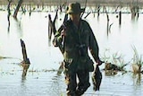 A duck hunter in a wetland