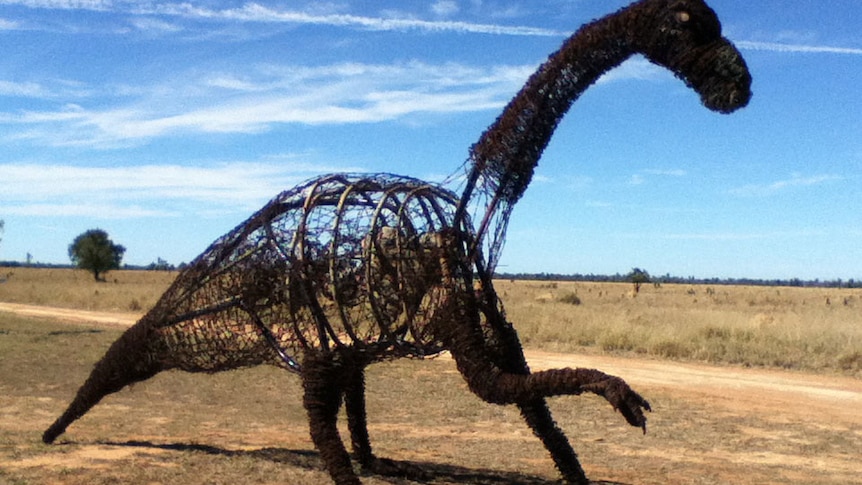 Seven-metre long dinosaur sculpture made out of barbed wire and scrap metal.
