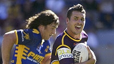 Brisbane half-back Brett Seymour makes a break against the Eels