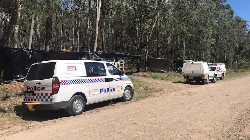 Police forensics and Qld Workplace Health and Safety at scene where man killed after falling into woodchipper near Gympie.