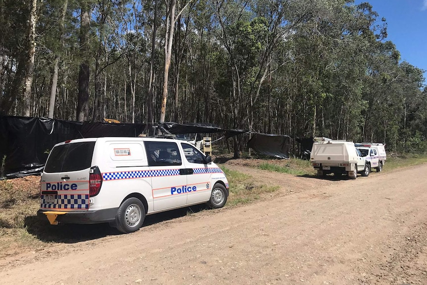 Police forensics and Qld Workplace Health and Safety at scene where man killed after falling into woodchipper near Gympie.
