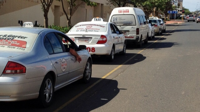 Parked taxis form a line