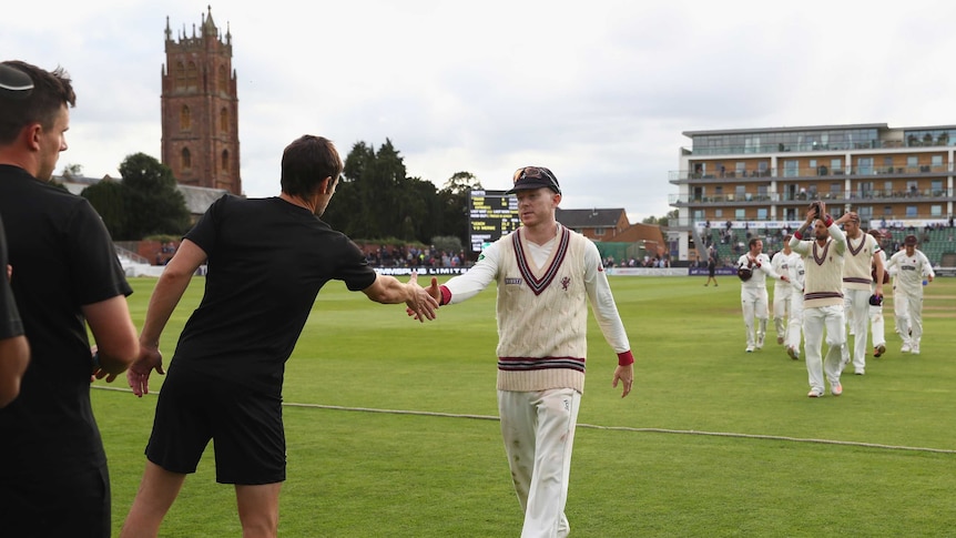 Somerset captain Chris Rogers (c) leaves the field after his final first-class cricket game.