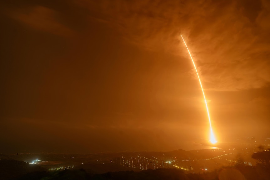 The Long March rocket leaves a fiery trail in the sky as it launches towards China's incomplete space station.