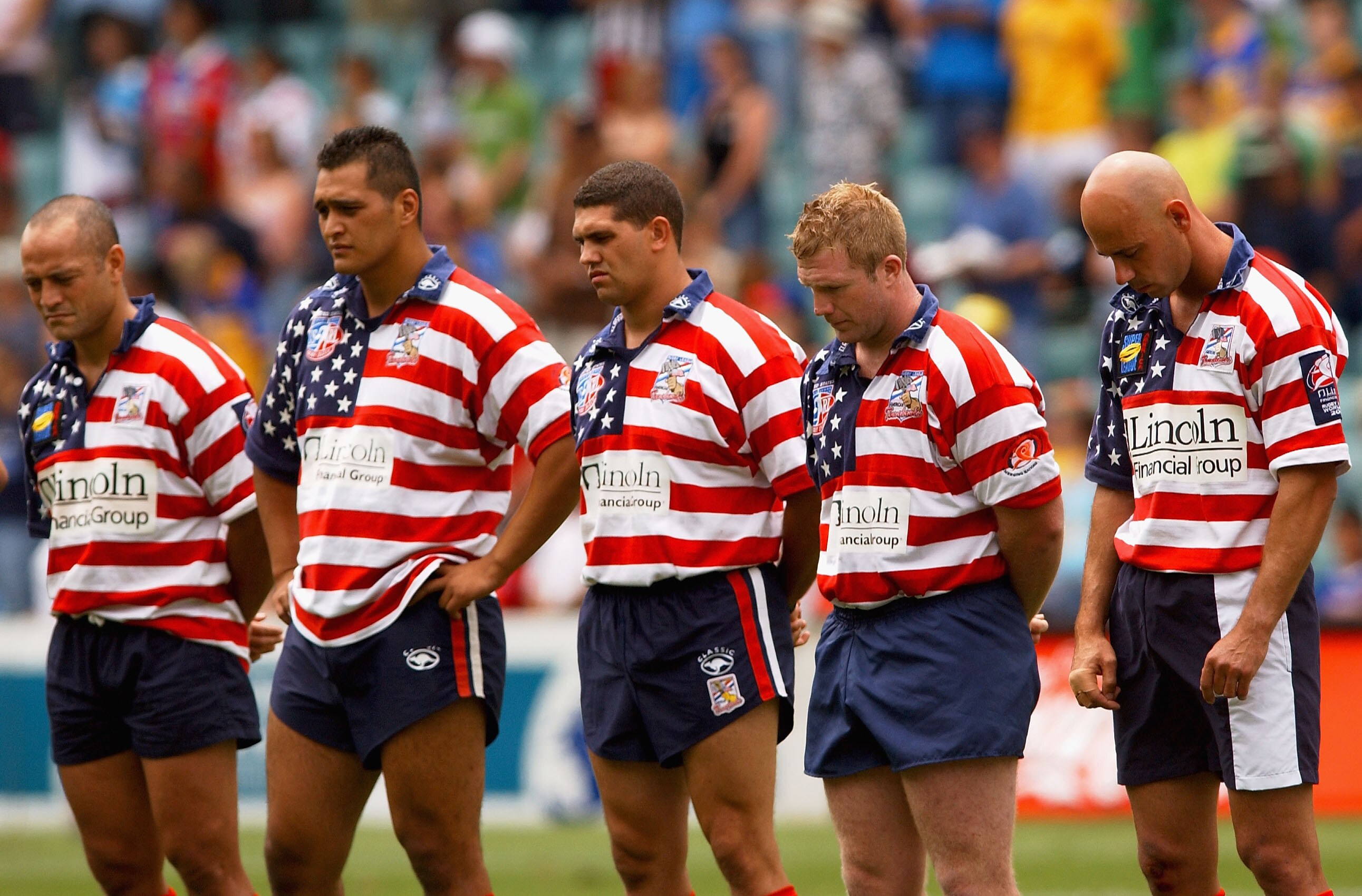 The USA Tomahawks players observe a minutes silence for the Astronauts that died in the Space Shuttle Columbia disaster before the start of the Coogee Dolphins tribute match played between the Coogee Dolphins and the USA Tomahawks during the second of the Rugby League World Sevens Tournament at Aussie Stadium in Sydney, Australia on February 2, 2003.