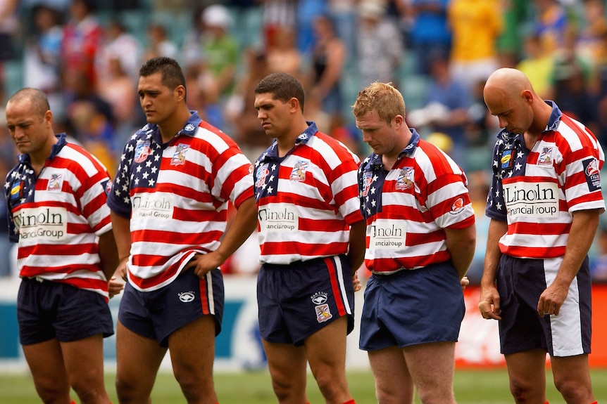 The USA Tomahawks players observe a minutes silence for the Astronauts that died in the Space Shuttle Columbia disaster before the start of the Coogee Dolphins tribute match played between the Coogee Dolphins and the USA Tomahawks during the second of the Rugby League World Sevens Tournament at Aussie Stadium in Sydney, Australia on February 2, 2003.