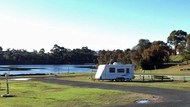 A lone caravan at the Treasure Island Caravan Park at Berriedale, Tasmania.