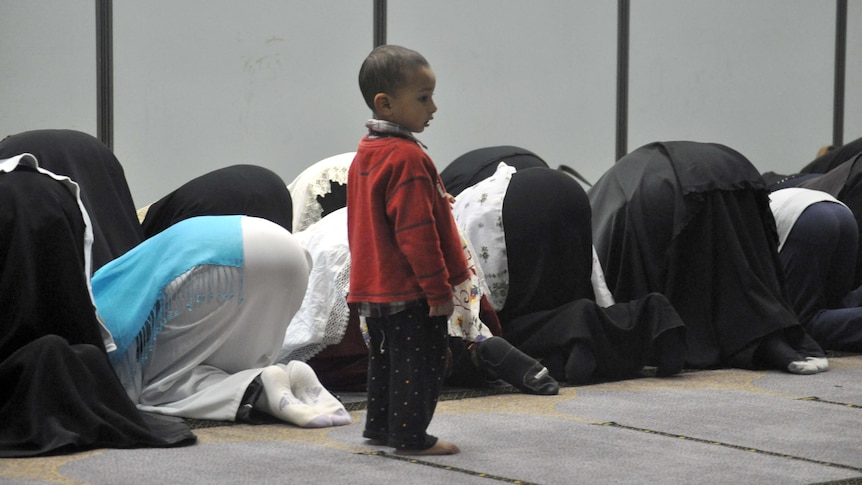 Women pray at Darra Mosque after breaking the fast for Ramadan on August 5, 2011.