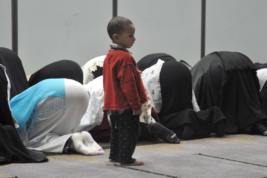 Women pray at Darra Mosque after breaking the fast for Ramadan on August 5, 2011.