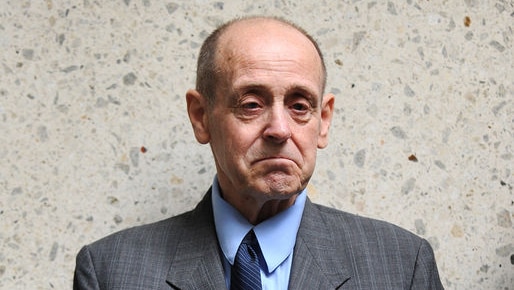 Convicted paedophile Dennis Ferguson stands outside the Brisbane District Court