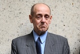 Convicted paedophile Dennis Ferguson stands outside the Brisbane District Court